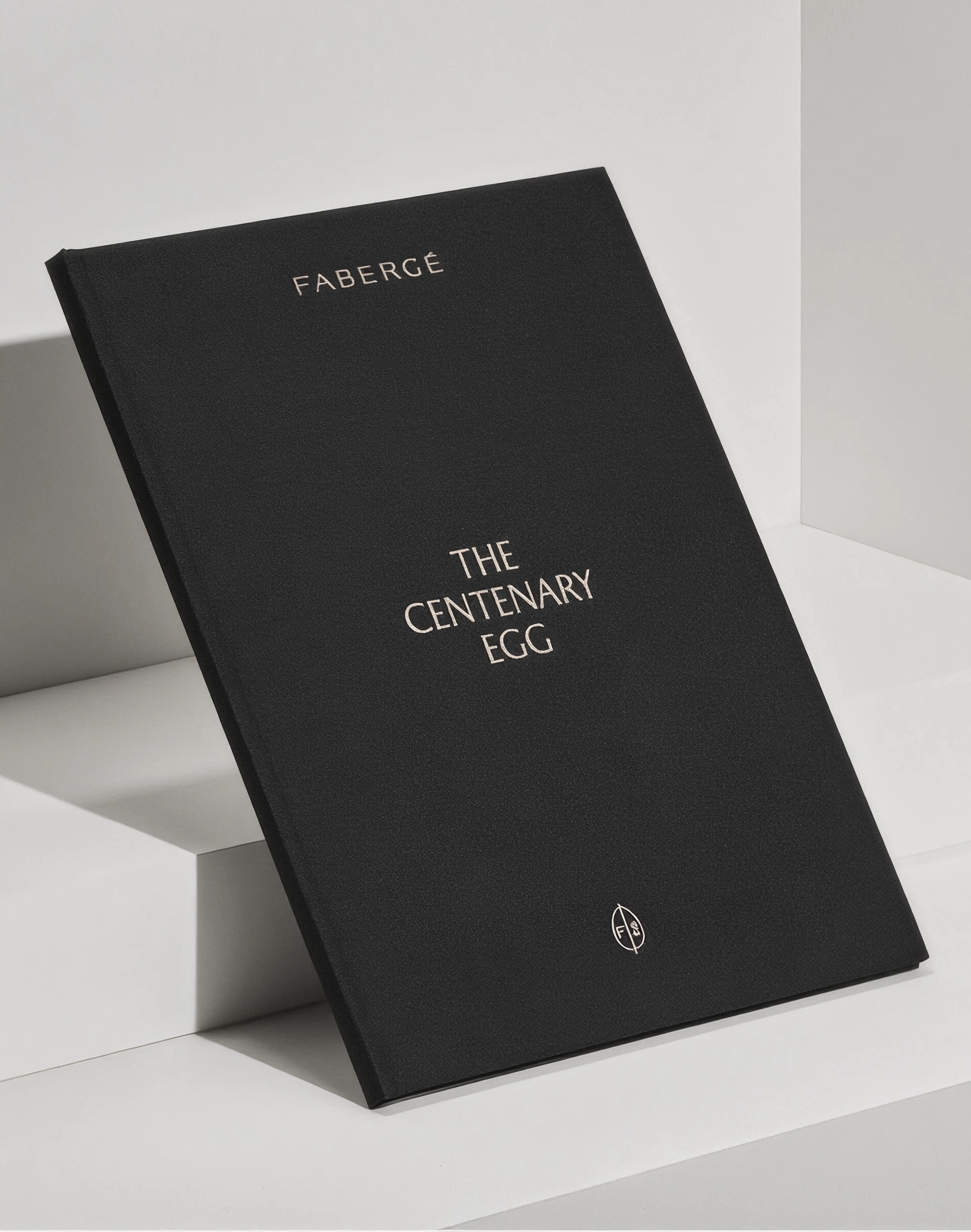 A black softcover book reading THE PATH YOU SEEK stands propped on a white plinth.