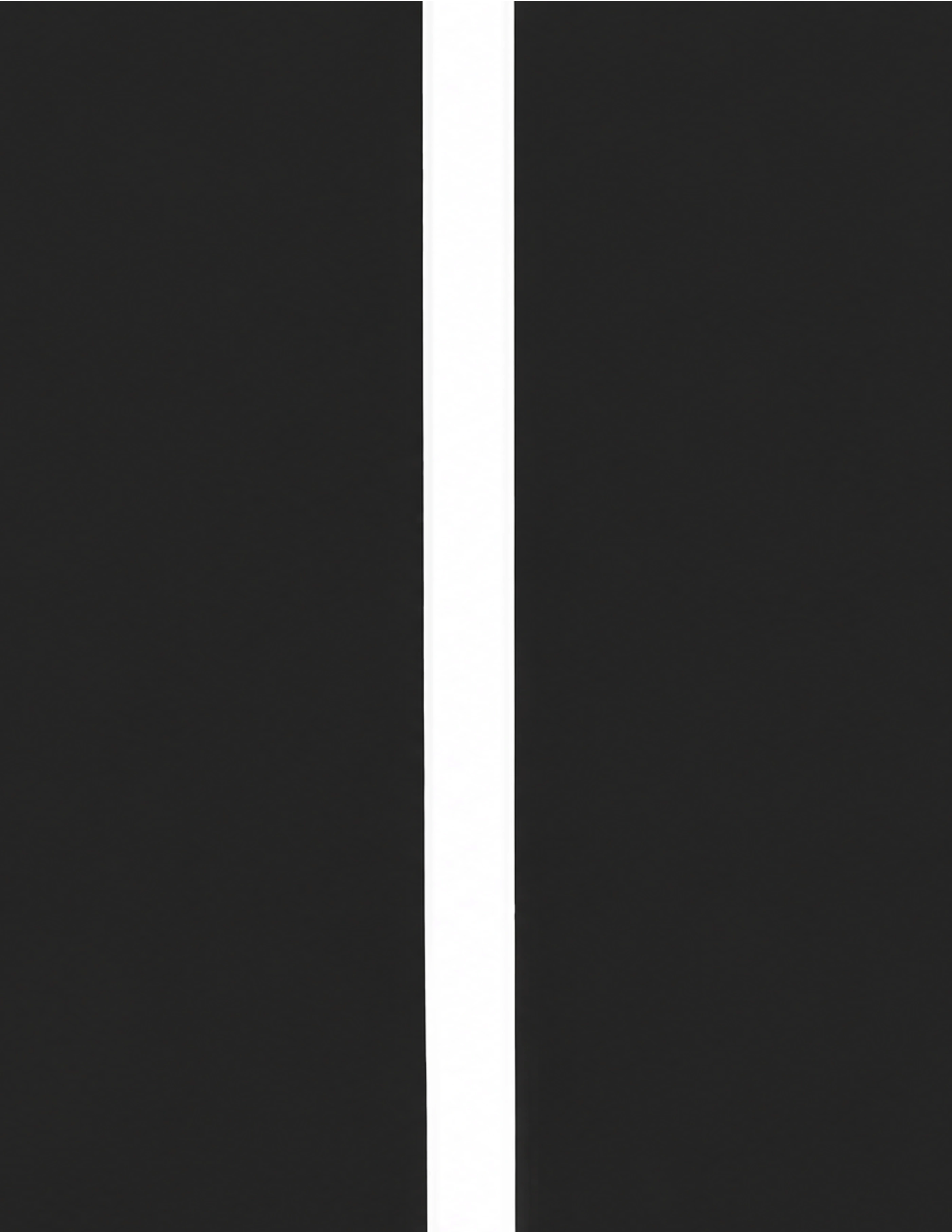 A dark wall is split by a single narrow vertical sliver of daylight.
