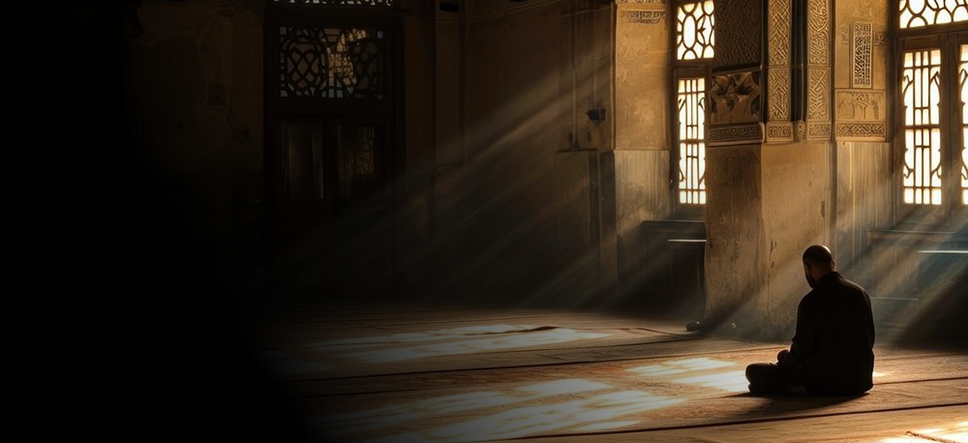 A warm golden ornate stone mosque hall where a row of tall carved lattice windows casts diagonal sunbeams across a bare plank floor onto a man seated in profile, right of centre.