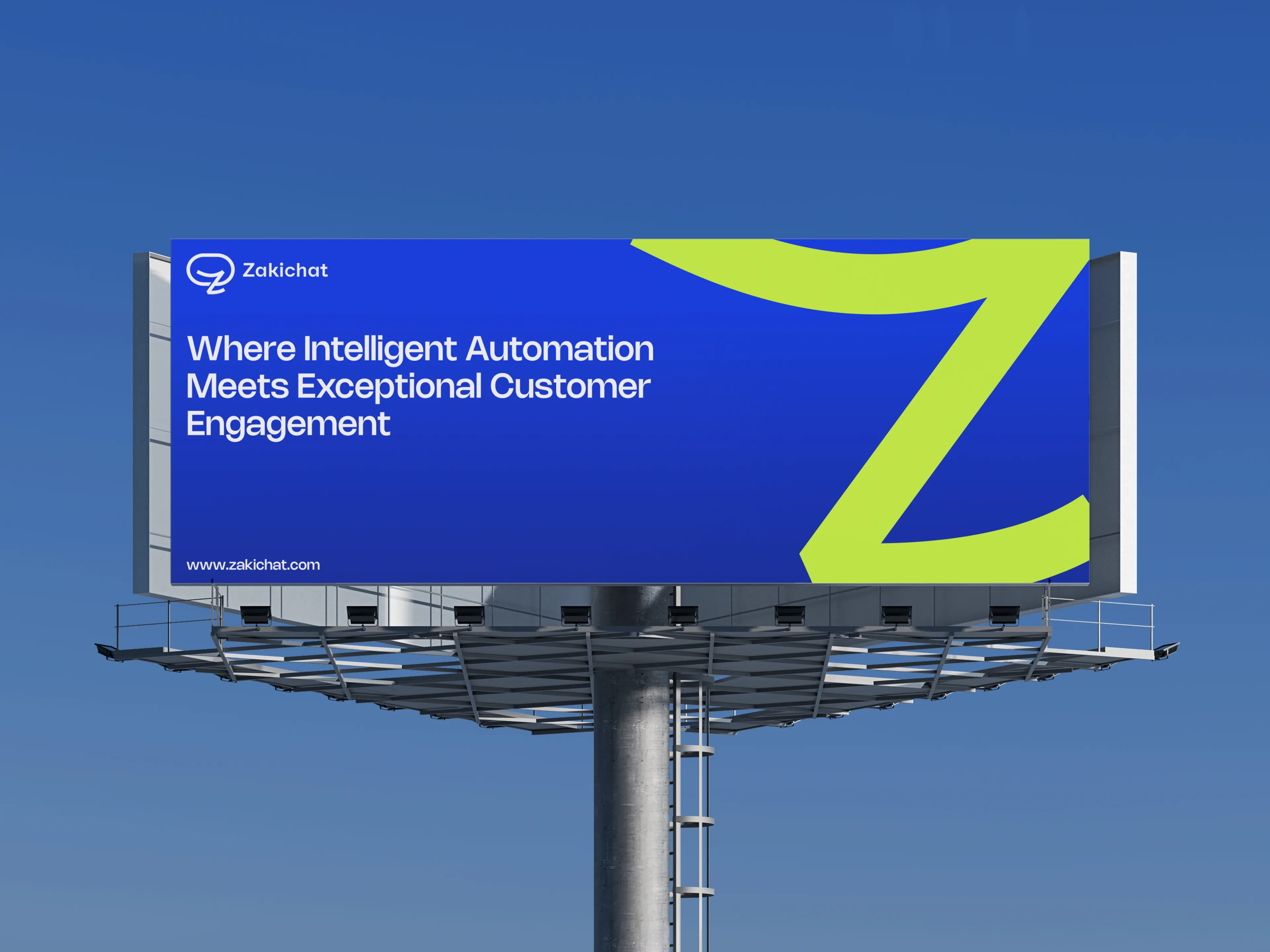 A single-pole highway billboard against a clear blue sky carrying a royal-blue Zakichat creative with the lockup, the headline Where Intelligent Automation Meets Exceptional Customer Engagement, the www.zakichat.com url and an oversized fluorescent-yellow Z bleeding off the right edge.